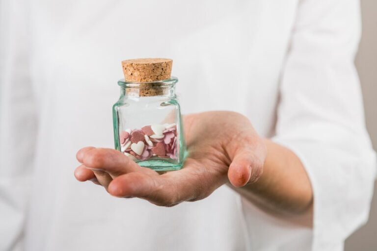 person-holding-little-jar-with-decorative-hearts_23-2147999677